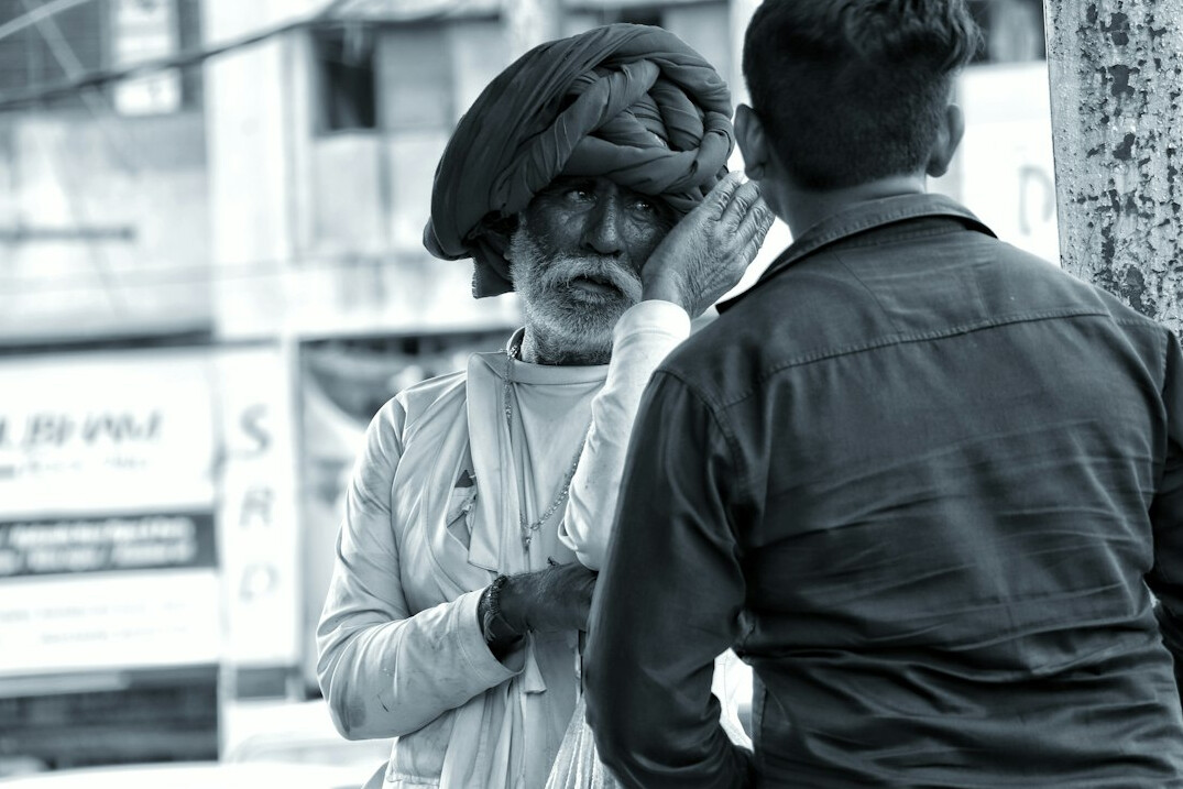 documentary photographer talking to locals
