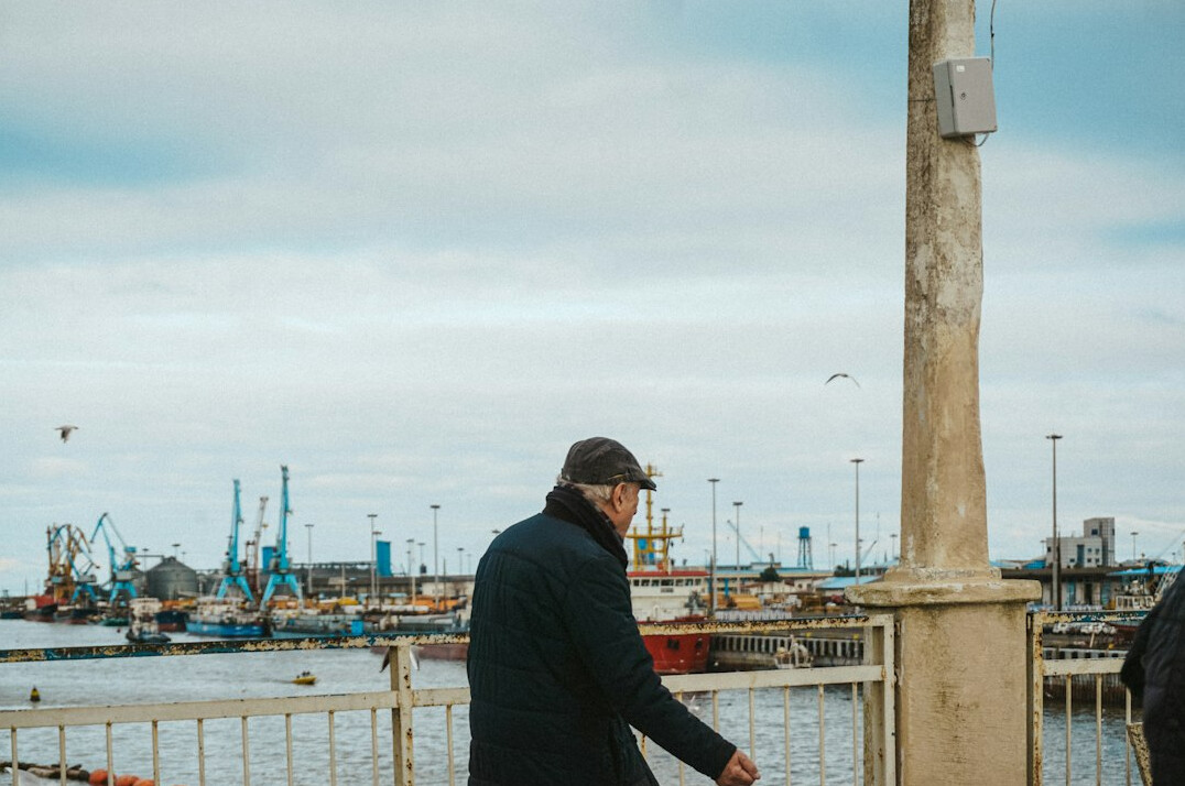 young fisherman at harbor