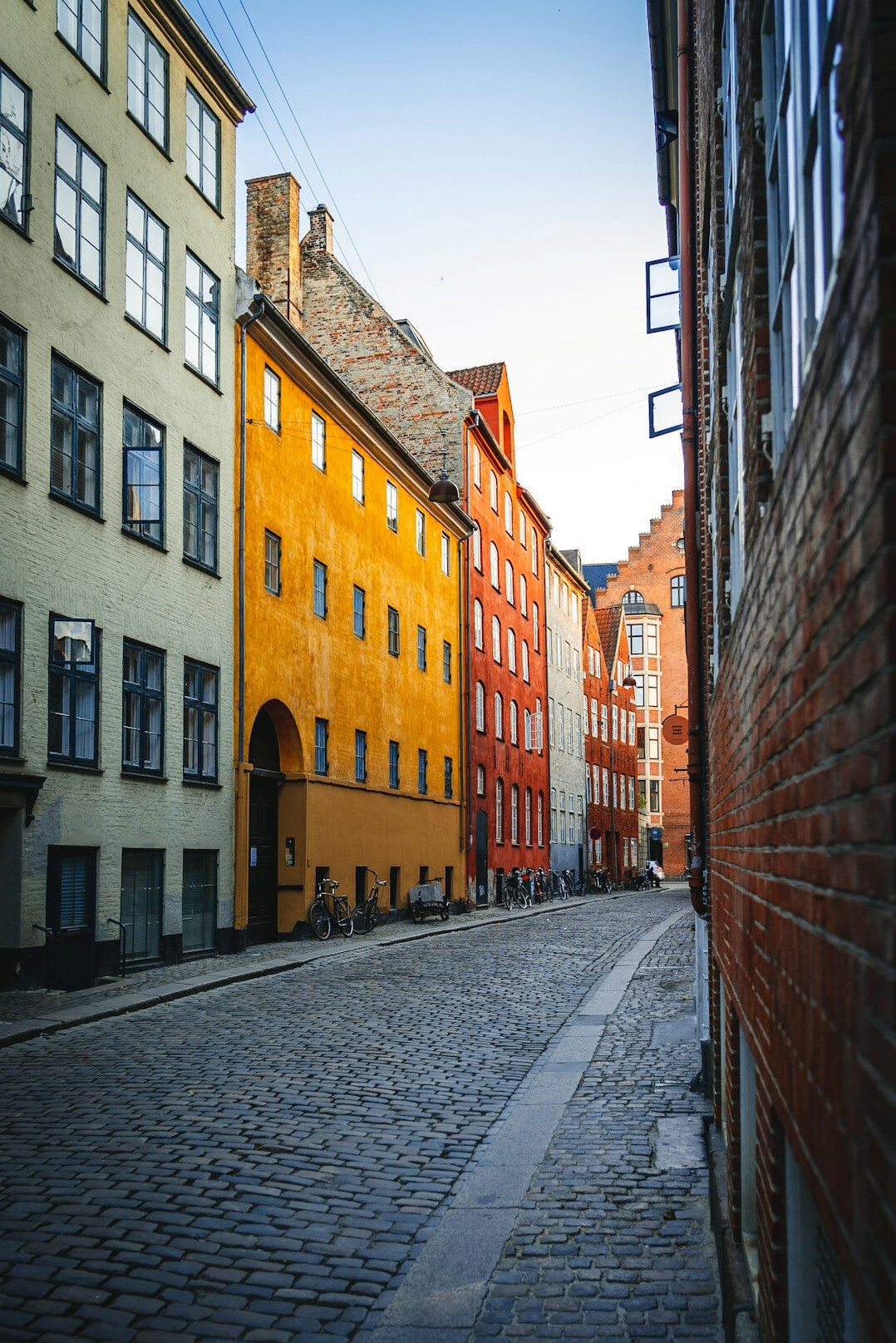 Narrow cobbled street with colorful facades in Denmark