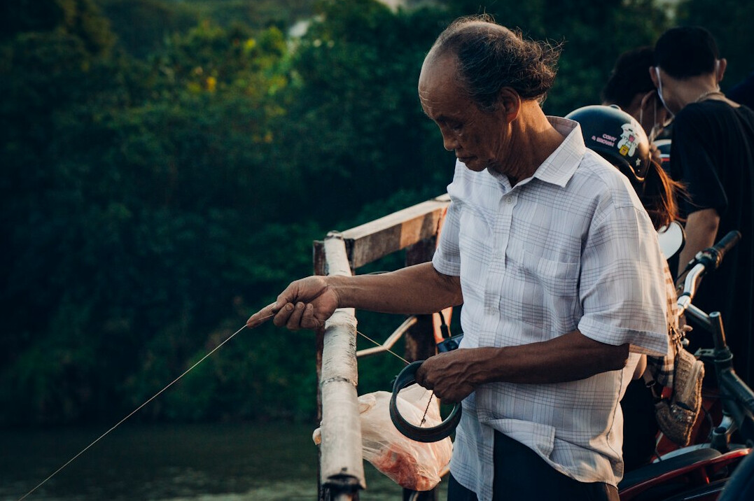 elderly fisherman sharing story